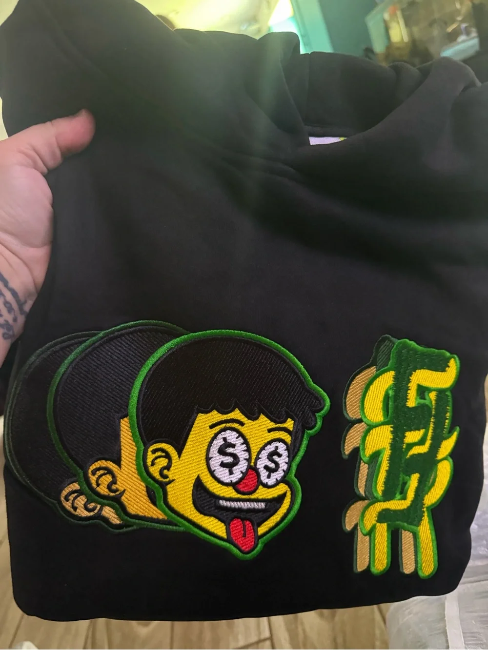 Black Hoodie with Yellow & Green Graphic Patch